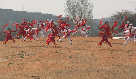 Chinese from surrounding villages perform the famous Ansai Waist Drum Dance  in its birthplace Ansai County, Shaanxi Province on April 7, 2017. The  dance is a unique, large-scale folk dance wth a