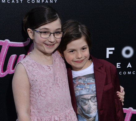 Cast members Lia Frankland  (L) and Asher Miles Fallica attend the premiere of the motion picture dramatic comedy "Tully" at Regal Cinemas LA Live in downtown Los Angeles on April 18, 2018. Storyline: Marlo, a mother of three including a newborn, who is gifted a night nanny by her brother. Hesitant to the extravagance at first, Marlo comes to form a unique bond with the thoughtful, surprising, and sometimes challenging young nanny named Tully.