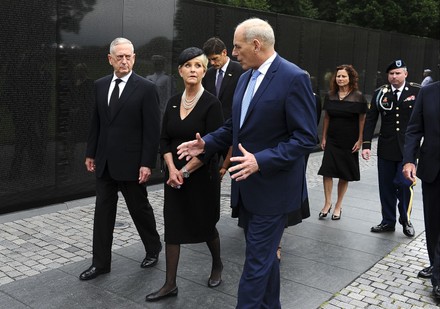 U.S. Secretary of Defense Mattis, General John Kelly, White House Chief of Staff and Cindy McCain, wife of late Senator John McCain, walk away after laying a ceremonial wreath at the Vietnam Veterans Memorial in Washington, District of Columbia, United Sta