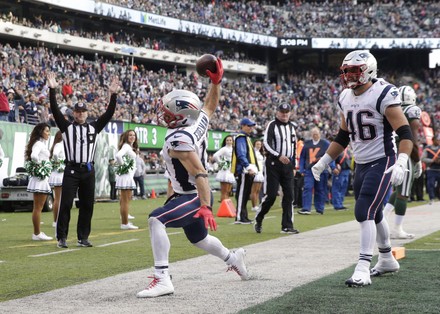 Fans wearing New England Patriots quarterback Tom Brady's number 12 and  wearing goat masks watch the game against the New York Jets at MetLife  Stadium in East Rutherford, New Jersey on November