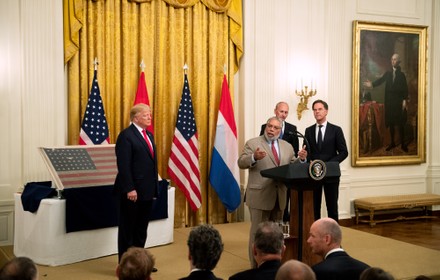 President Trump recieves a WWII Era American Flag from Dutch PM Rutte at the White House, Washington, District of Columbia, United States - 18 Jul 2019