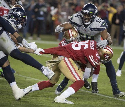 Santa Clara, United States. 12th Nov, 2019. San Francisco 49ers running  back Tevin Coleman (26) is tackled by Seattle Seahawks middle linebacker Bobby  Wagner (54) with an assist by a jersey pull