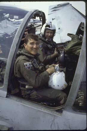 John Lehman  posing beside attack plane, Virginia Beach, Virginia, USA