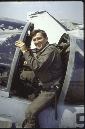 John Lehman  posing beside attack plane, Virginia Beach, Virginia, USA