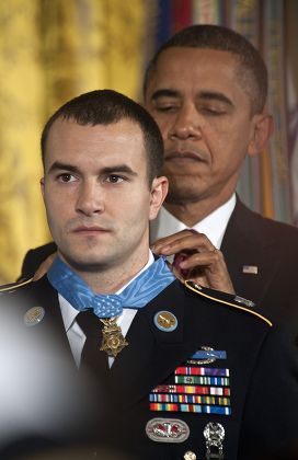 President Barack Obama presenting the Medal of Honor to U.S. Army Staff Sergeant Salvatore Giunta in a ceremony in the East Room of the White House, Washington DC, America  - 16 Nov 2010