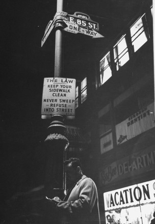 Man Leaning Against Lamp Post Reading Editorial Stock Photo - Stock ...