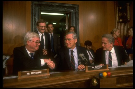 Senators Moynihan  & Bentsen shaking hands, congratulatory- style, w. Sen. Finance Comm. comrade Packwood  looking on, after budget bill passage.