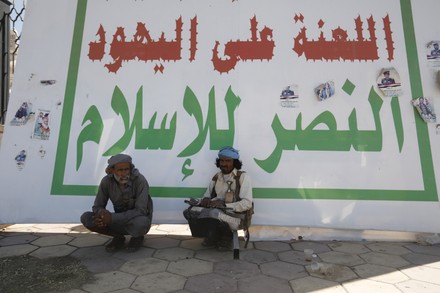 Two Houthi Fighters Sit Next Banner Editorial Stock Photo - Stock Image ...