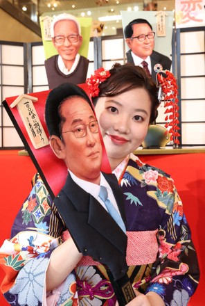 Japanese doll maker Kyugetsu displays hagoita with depiction of the faces of this year's news makers, Tokyo, Japan - 07 Dec 2021