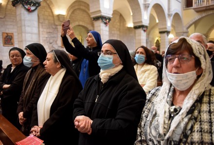 Palestinians Attend Christmas Morning Mass In Bethlehem, West Bank - 25 Dec 2021