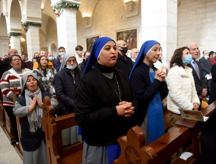 Palestinians Attend Christmas Morning Mass In Bethlehem, West Bank - 25 Dec 2021