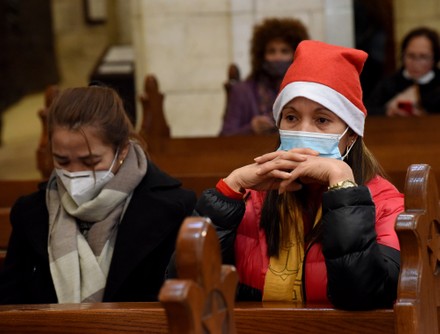 Catholic Foreign Workers Attend Christmas Morning Mass In Bethlehem, West Bank - 25 Dec 2021