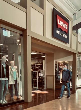 fotos de Man Walks Past Levis Store - Foto de stock de contenido editorial: imagen de stock | Shutterstock Editorial