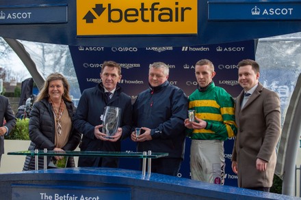 The winning owners and trainers with Sir Tony McCoy (second left) after Fakir D'Oudairies ridden by jockey Mark Walsh after winning the Betfair Ascot Steeple Chase at Ascot Racecourse