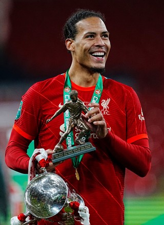 Download Virgil Van Dijk With The Championship Cup Wallpaper