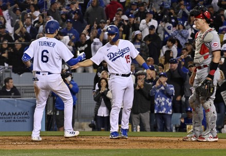 Los Angeles, United States. 16th Apr, 2022. Los Angeles Dodgers' shortstop  Trea Turner (6) celebrates with teammate Austin Barnes (15) after hitting a  two-run homer off Cincinnati Reds starting pitcher Hunter Greene