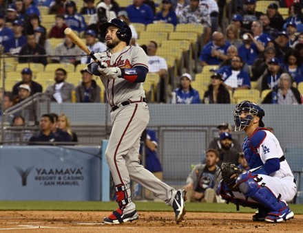 Travis d'Arnaud of the Atlanta Braves hits a solo home run against