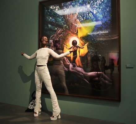 David LaChapelle I Believe in Miracles exhibition at MUDEC attended by David LaChapelle, Reiner Opoku and Denis Curti curators with 90 works exhibited from 22 April to 11 September 2022 In the picture: Guetcha Tondreau model with work created by David LaChapelle