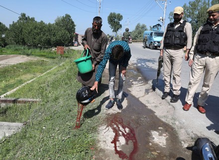 A policeman shot at by militants in Srinagar, India - 07 May 2022