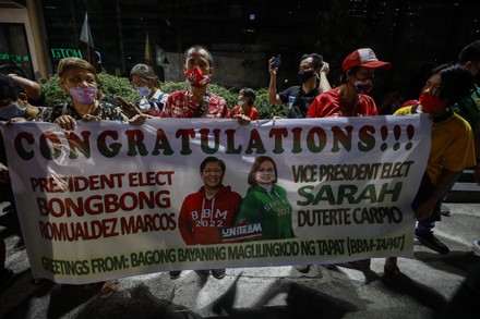 Supporters of Ferdinand 'Bongbong' Marcos Jr., son of the late president Ferdinand Marcos, arrive at the Marcos elections campaign headquarters in Mandaluyong City, Metro Manila, Philippines, 25 May 2022. The Philippine Congress on 25 May officially proclaimed Bongbong Marcos as the President-elect and Sara Duterte as the Vice President-elect in the May 2022 national elections.