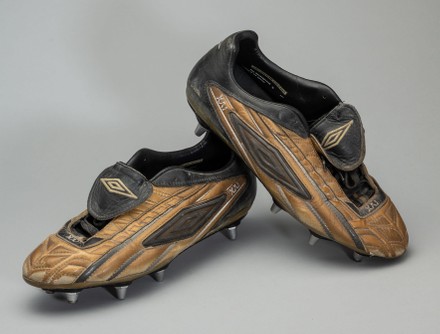 Also in the sale, a pair of Umbro XAI boots Wayne Rooney wore when he scored his first Premier League goal as a 16 year old fetched £10,540.

An infamous 'invisible' grey football shirt worn by Manchester United legend Eric Cantona has today sold for £12,400.

The club played in the ill-advised strip for away games during the 1995-96 Premier League season. But they ditched the jersey after losing four out of five games in it.

Things came to a head during an away game at Southampton in April 1996 where the team went in at half-time 3-0 down. The players complained the grey shirts made their teammates blend in with the crows and they couldn't pick each other out on the pitch. 

Sir Alex Ferguson ordered his players to change into a blue and white coloured strip, although they still lost the match 3-1.

The long-sleeved XXL-sized Umbro shirt, with Cantona's name and number seven on the back, went under the hammer with Graham Budd Auctions, of London.