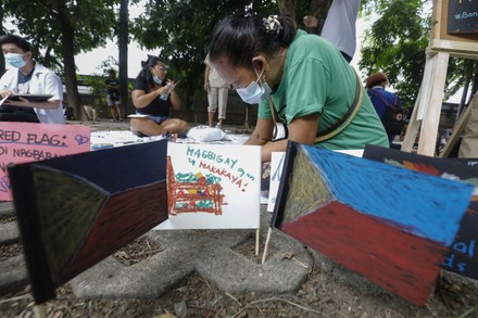Members of various human rights advocacy groups create small banners with patriotic messages and images on Independence Day at the Bantayog ng mga Bayani (Monument of Heroes) in Quezon City, Metro Manila, Philippines, 12 June 2022. Human rights groups marked the 124th Independence Day of the Philippines by honoring victims of the country's Martial Law years under the late president Ferdinand Marcos. Survivors expressed calls for vigilance in defending human rights as the late president's son, Ferdinand 'Bongbong' Marcos Jr., is set to become the next president after winning in the 09 May national elections.
