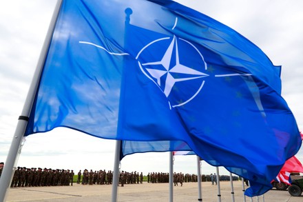 Nato Flag Waves Wind Troops Stand Editorial Stock Photo - Stock Image ...