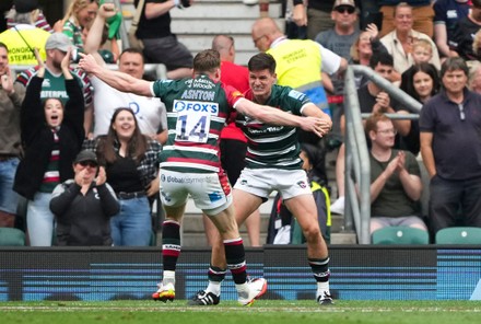 Freddie Burns of Leicester Tigers celebrates at the end of the match with Chris Ashton after his team won 15-12