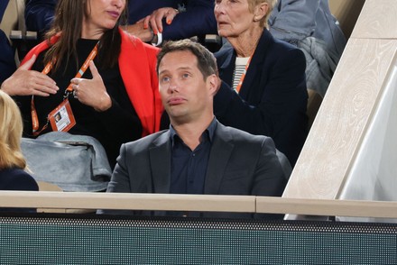 Xavier Niel and Delphine Arnault in stands during French Tennis