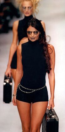 Model Helena Christiansen In Chanel Swimwear And Silence Of The Lambs Style Mask At Paris Fashion Show.
