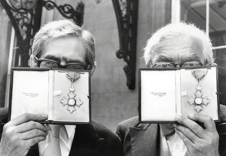 Writer/broadcasters Dennis Norden (tie) And Frank Muir (bow Tie) At Buckingham Palace After Being Awarded Their Cbe's. (1980 Pic).