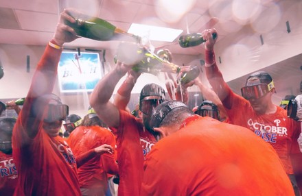 Members of the Philadelphia Phillies celebrate in the locker room