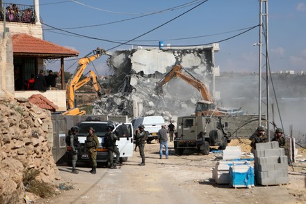 Israeli Bulldozers Demolish Threestorey Palestinian Building Editorial ...