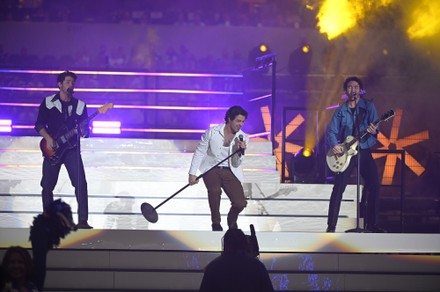 The Jonas Brothers perform during halftime an NFL football game