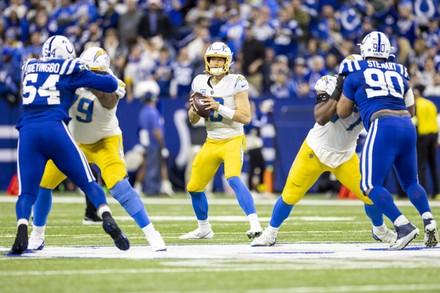 Indianapolis, Indiana, USA. 26th Dec, 2022. Indianapolis Colts tight end  Jelani Woods (80) catches the ball as Los Angeles Chargers defensive back  Michael Davis (43) defends during NFL game in Indianapolis, Indiana.