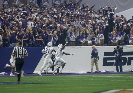 December 31, 2022 Michigan Wolverines wide receiver A.J. Henning #3 carries  the ball and is tackled by TCU Horned Frogs linebacker Dee Winters #13  during the semi-final playoff football game between the