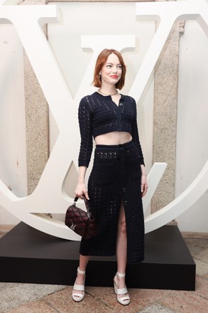 Emma Stone poses at the photocall for Louis Vuitton Cruise