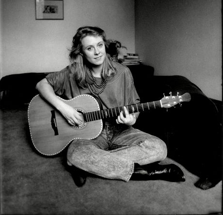 Actress Cathryn Harrison At Home In Battersea Playing Her Guitar