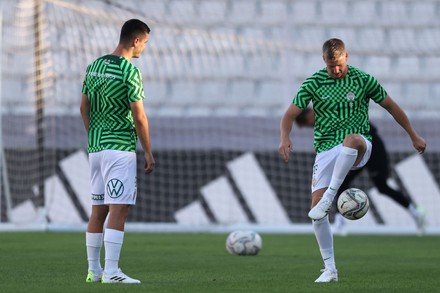 Barnabas Varga of Ferencvarosi TC shoots on goal beside Marcelina News  Photo - Getty Images