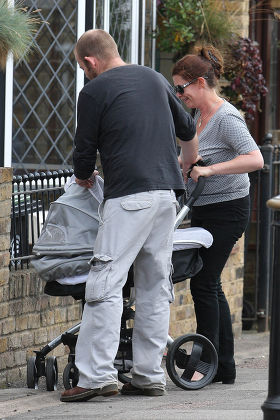 Hannah Waterman and her partner Huw Higginson take their newly born son out in his pram, London, Britain - 10 Aug 2011