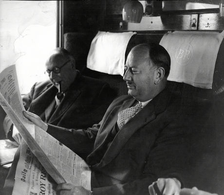 Baron Beeching (doctor Richard Beeching) Chairman Of British Railways Seen Here In Train Carriage With Copy Of Daily Mail.