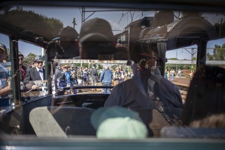 A Man is Sitting on the Bus Near a Glass Window with Steam Stock