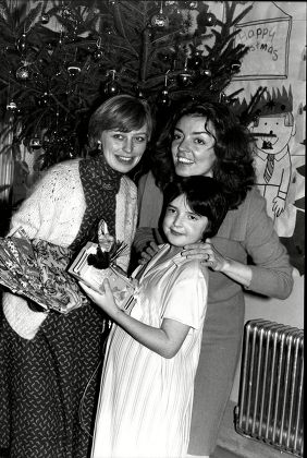 The Ray Cooney Presentations At Great Ormond Street Hospital For Children Actress Eva Lohman Left And Actress Of The Year Elizabeth Quinn With Young Clare Hunn At Patient At The Hospital