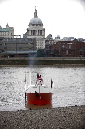 Sculptor Andrew Baldwin On Board His Work 'the Boat That Walked' A Kinetic 40ft Boat With Legs. However On Arriving At The Thames Foreshore By Tate Modern He Could Not Get The Boat Out Of The Water. Picture By Glenn Copus