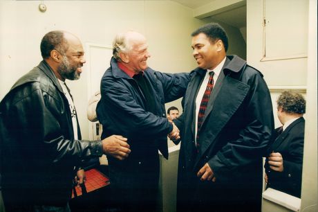 Boxers Muhammad Ali (formerly: Cassius Clay) (right) And Henry Cooper (centre) Meeting At Cooper's Old Kent Road Gym In South London. Ali Was There For A Book Signing. Also Pictured (left) Is Photographer Howard Bingham Who Photographed Ali Through