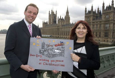 Gary Mckinnon's Mother Janis Sharp With A Christmas Card Signed By Mp's Trying To Stop Gary Being Extradited To America For Trial On Computer Hacking Charges. Pic Shows Janis With Gary's Mp David Burrows.