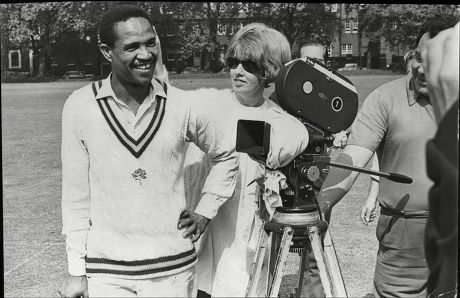 West Indian Skipper Sir Gary Sobers Who Now Skippers Nottinghamshire Is Seen In His New Role As A Film Actor. He Is Pictured During The Shooting Of Scenes For 'two Gentlemen Sharing' At Westminster School Cricket Ground. With Him Is Esther Anderson
