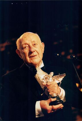 Sir Alec Guinness With One Of His Awards At The Evening Standard Film Awards