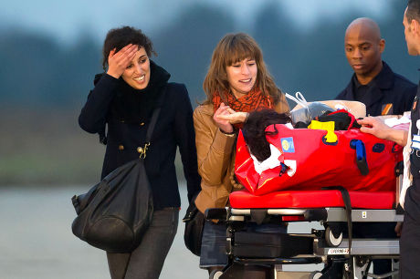 Edith Bouvier and William Daniels arrive at Villacoublay military airport, France - 02 Mar 2012