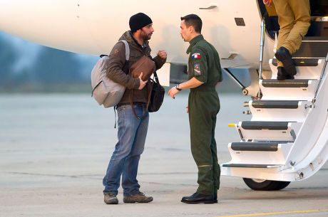 Edith Bouvier and William Daniels arrive at Villacoublay military airport, France - 02 Mar 2012